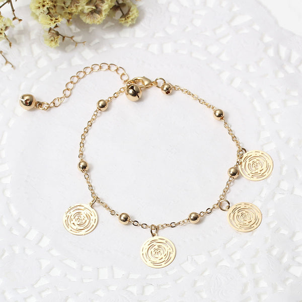 SEXY SPARKLES Filigree Stamping Bell Bracelet  Golden Plated Whit Round Hollow Pendants