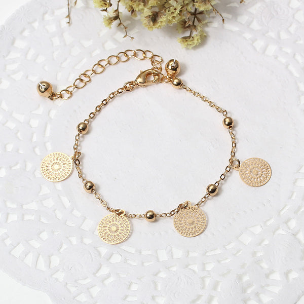 SEXY SPARKLES Filigree Stamping Bell Bracelet Gold Plated Whit Round Hollow Pendants