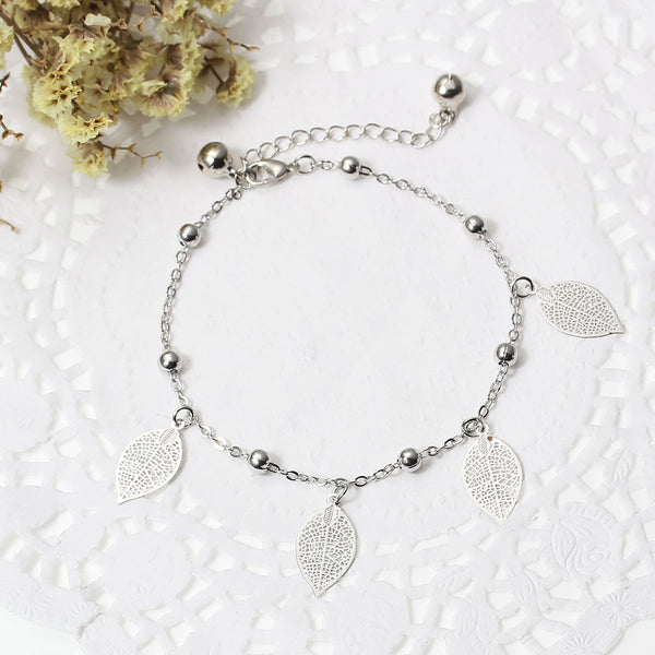 SEXY SPARKLES Filigree Stamping Bell Bracelet Whit Hollow Leaf Pendants